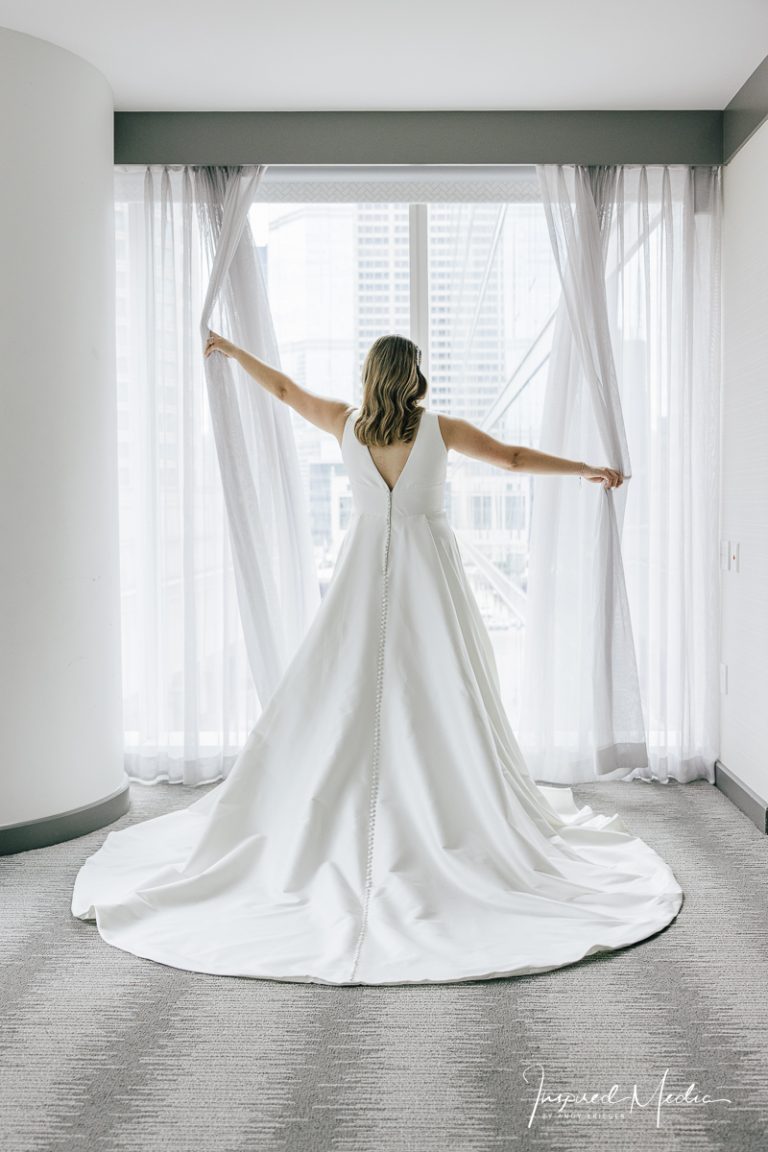 bride in white window Chicago hotel