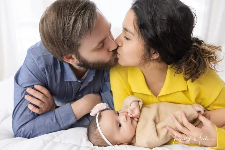 mom and dad and infant baby