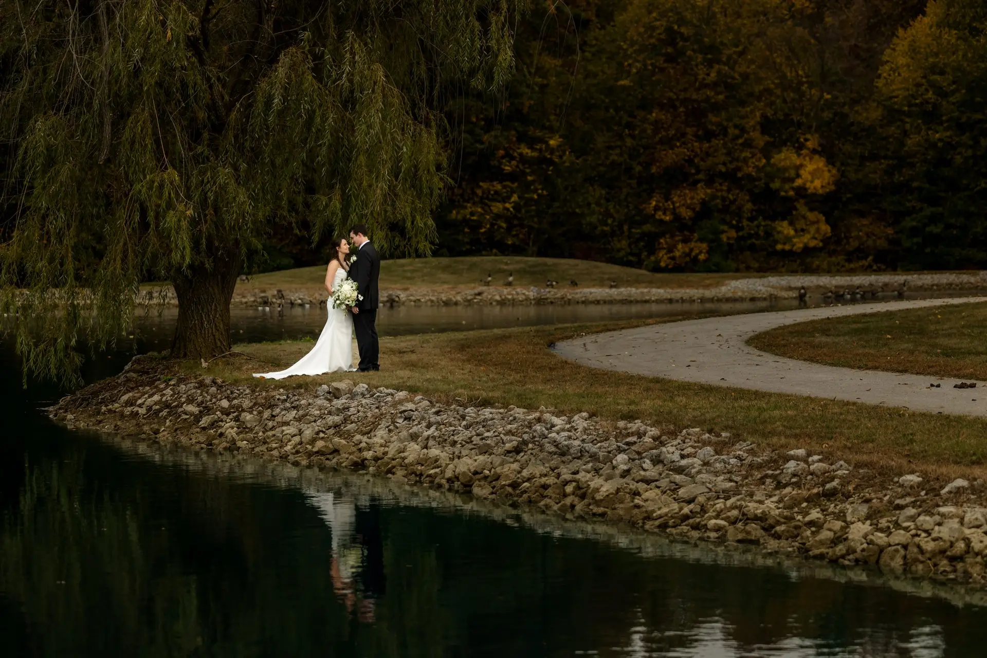 couple by lake at The Lodge at Camp Red Cedar photographed by Andy Krieger from Inspired Media