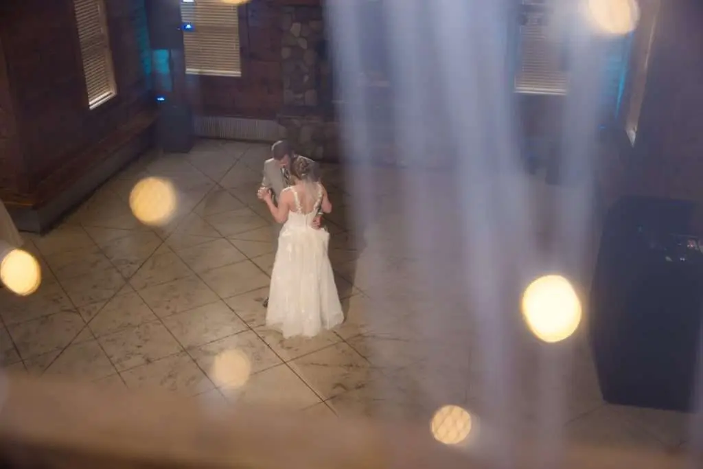 first dance from balcony at Caberfae Peaks - Cadillac wedding photographer