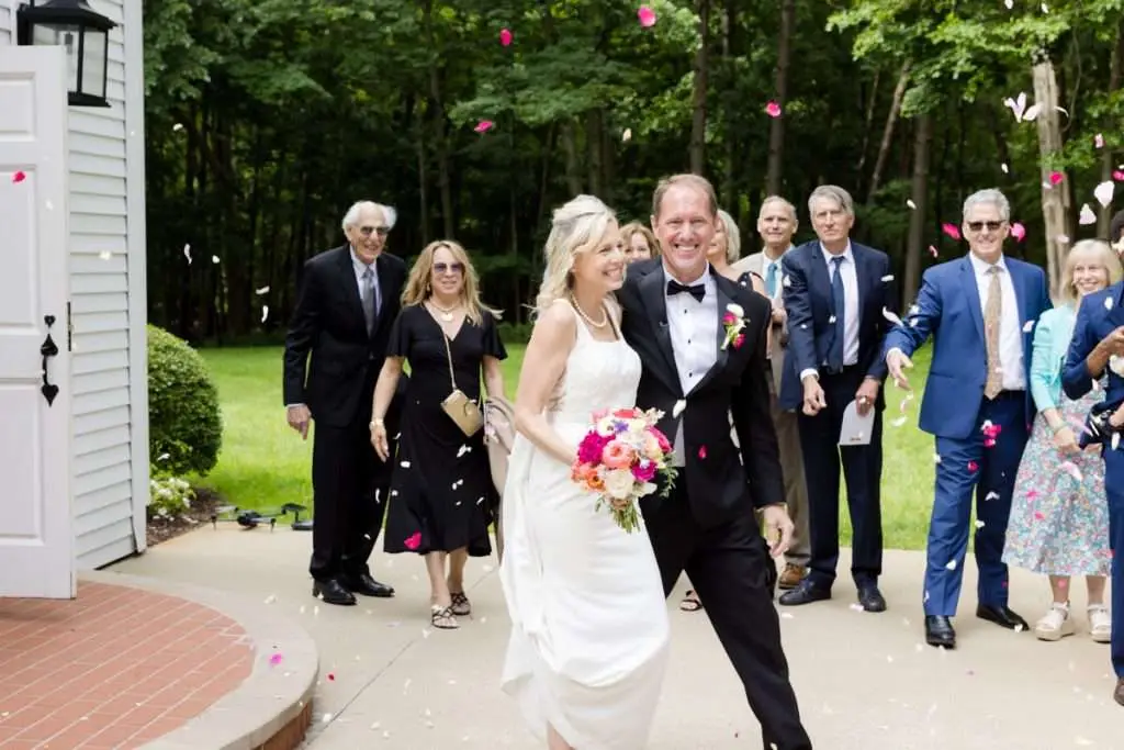 guest throwing flower petals