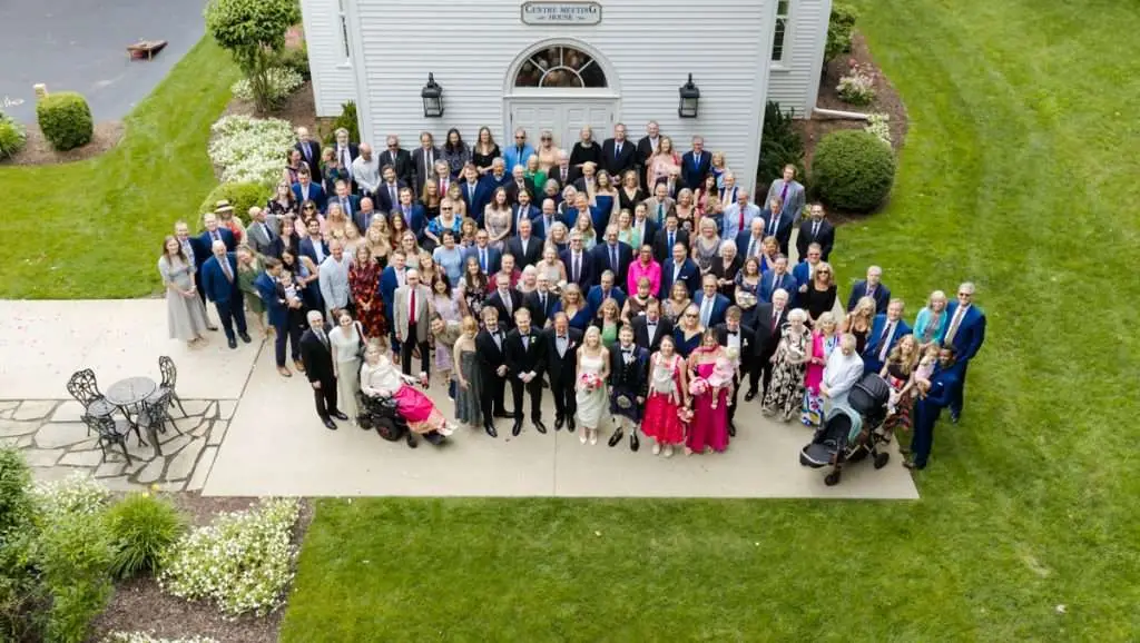 guests in front of Little White Chape from Drone