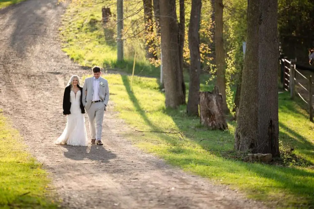 Couple walking in woods for a quiet moment that is unposed