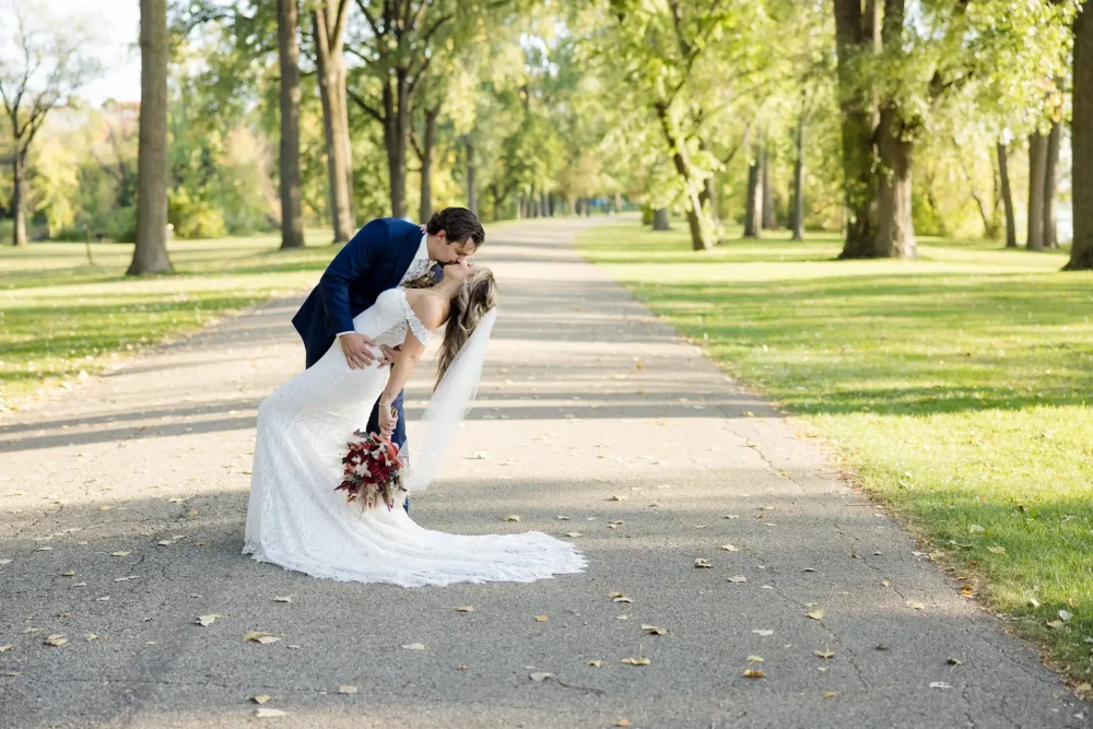 bride and groom dip kiss golden hour