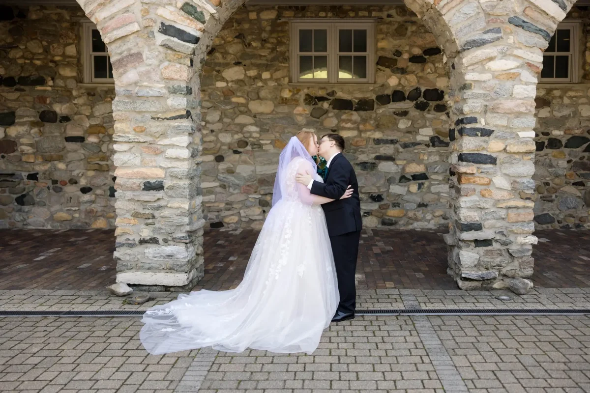 Couple in stone courtyard at Castle Farms photographed by Andy Krieger of Inspired Media